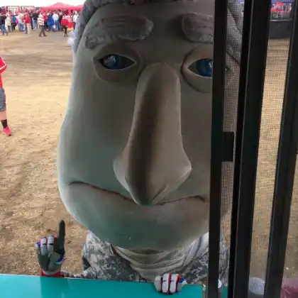 Crew member serving a guest at the truck window.