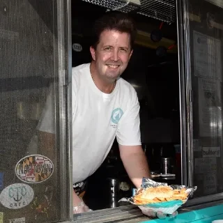 Picture of chef John J. Talman IV working on the CrabTown Curbs Cuisine food truck