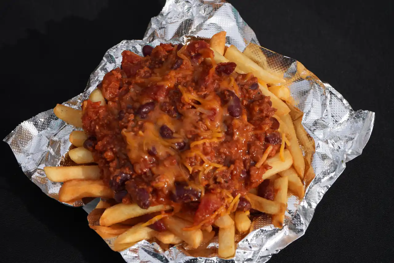 Chili fries topped with shredded cheese