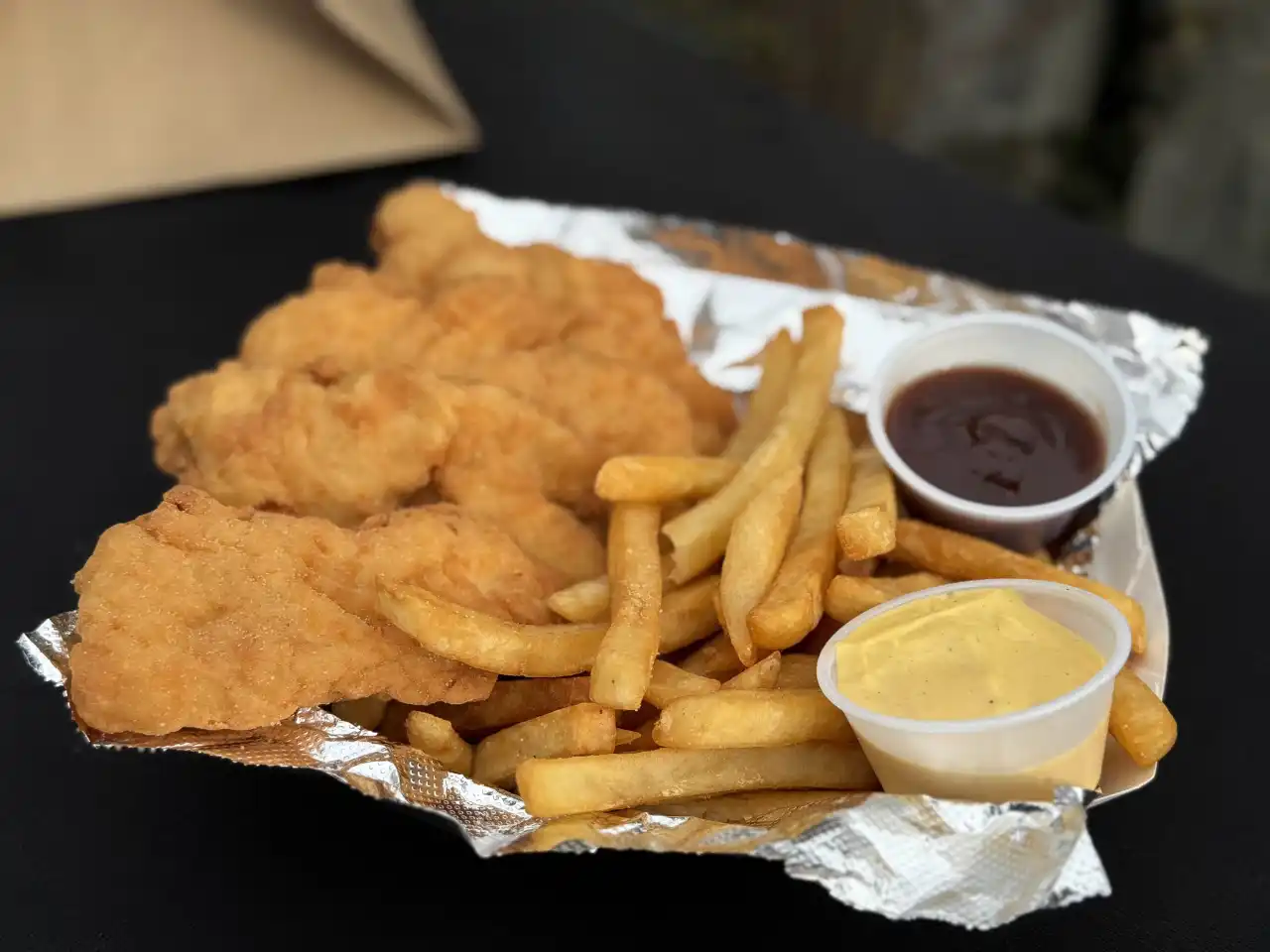 Chicken tenders with fries and dipping sauce